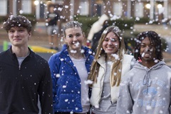 volunteers in the snow at Santa Party